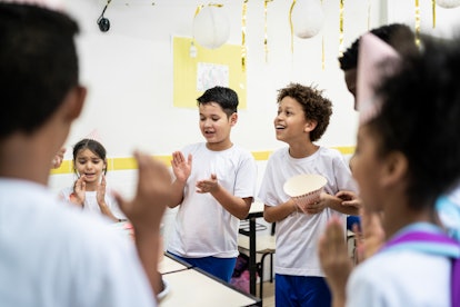 Elementary school class celebrating a birthday at school