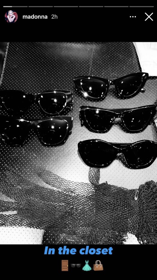 Madonna's black sunglasses collection in a tray.