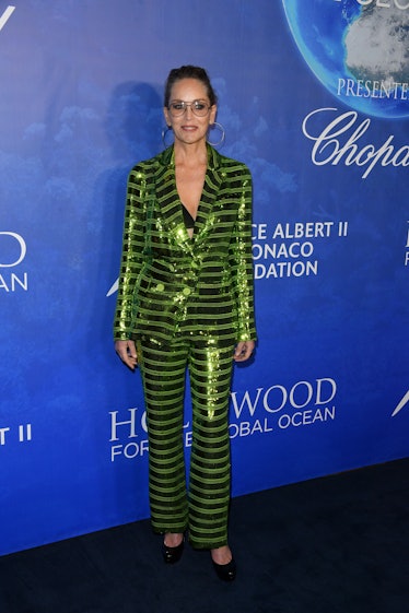 Sharon wearing a green striped suit