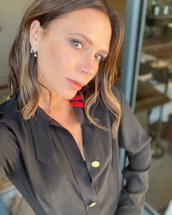Victoria Beckham wears black military detail pleated dress from her brand, Victoria Beckham, on Inst...