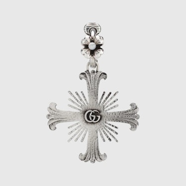 Single unisex earring with flower and cross from Gucci.