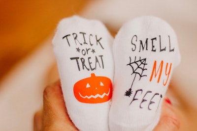 These Halloween baby socks from Etsy say "Trick-Or-Treat Smell My Feet."