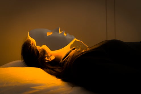Woman getting LED light treatment