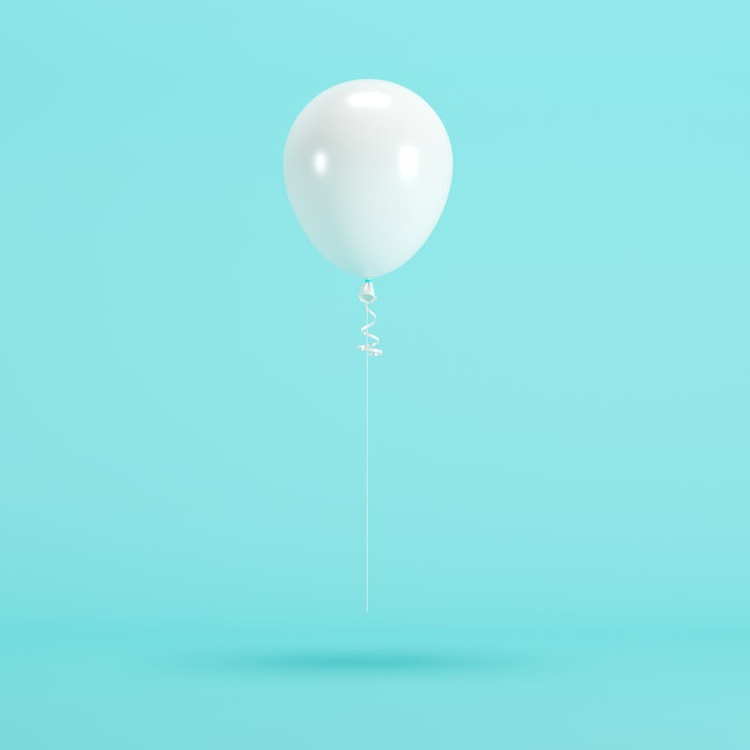 white balloon floating on blue background