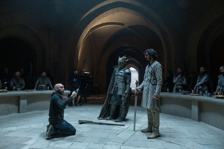 David Lowery directing actors Dev Patel and Ralph Ineson on the set of The Green Knight