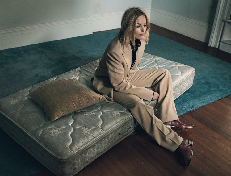 Margot Robbie on a bare mattress. 