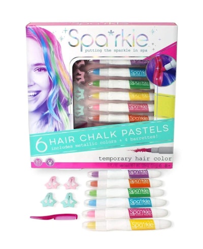 Product photo; packaging for six-piece hair chalk set with chalks and barrettes displayed in front o...