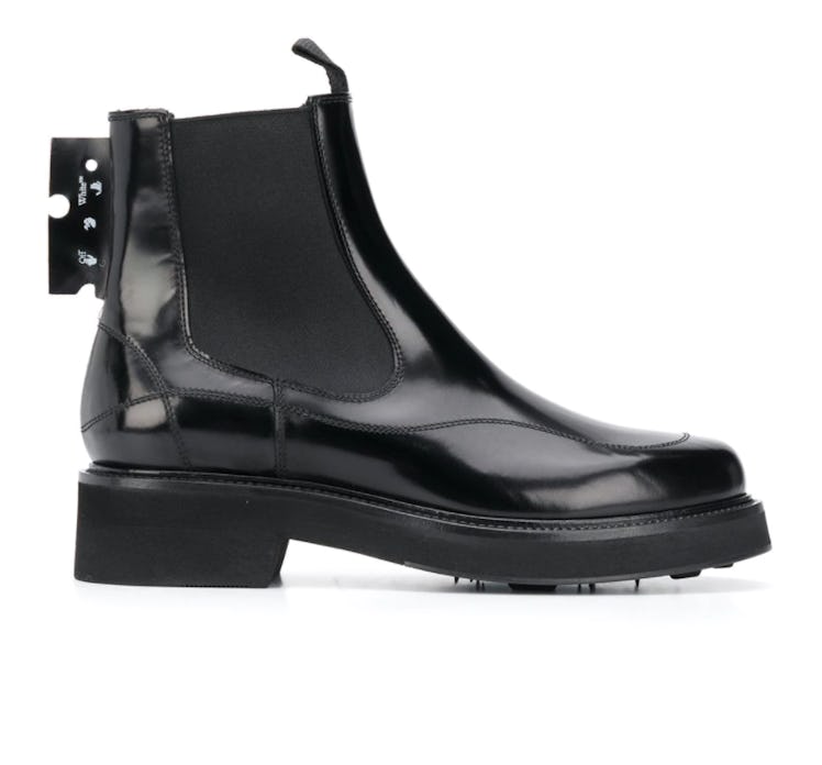 Off-White's logo patch chelsea boots in black. 