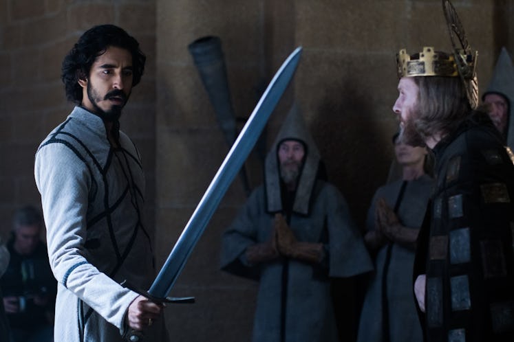 Dev Patel holding a sword in The Green Knight