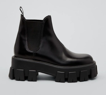 Prada's Leather Lugged-Sole Chelsea Boots in black. 