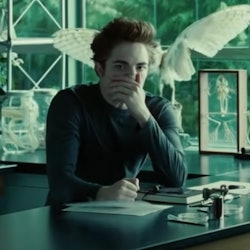 Edward Cullen (Robert Pattinson) holds his face in horror in a still from the first Twilight film.
