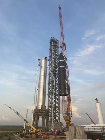 SpaceX Starship moving into position onto the Super Heavy booster.