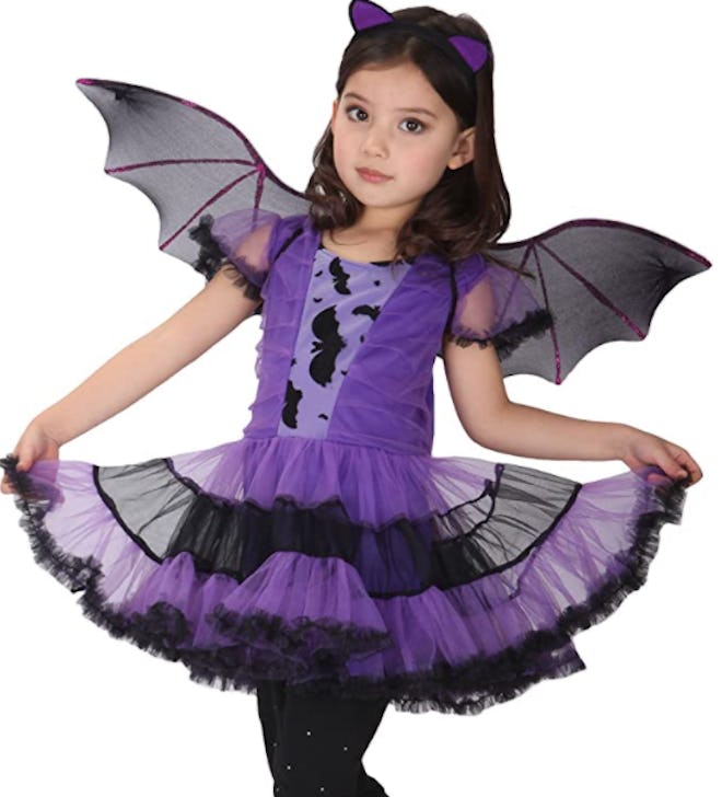 Girl dressed in a bat costume