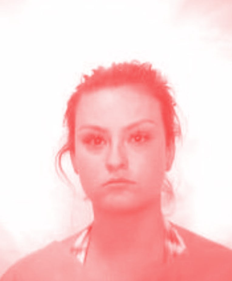 Mugshot of woman with fake "maderna" vaccine card