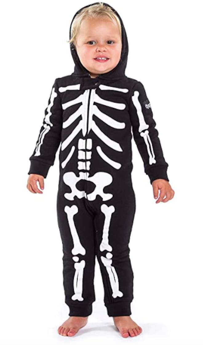 Toddler wearing skeleton Halloween costume