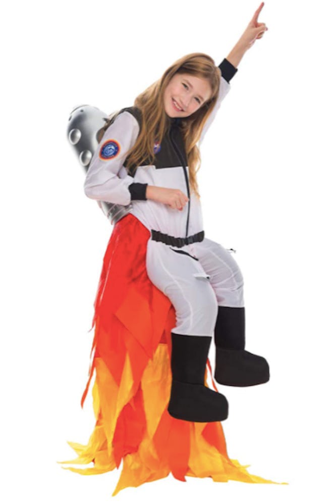 Girl wearing a flying astronaut costume