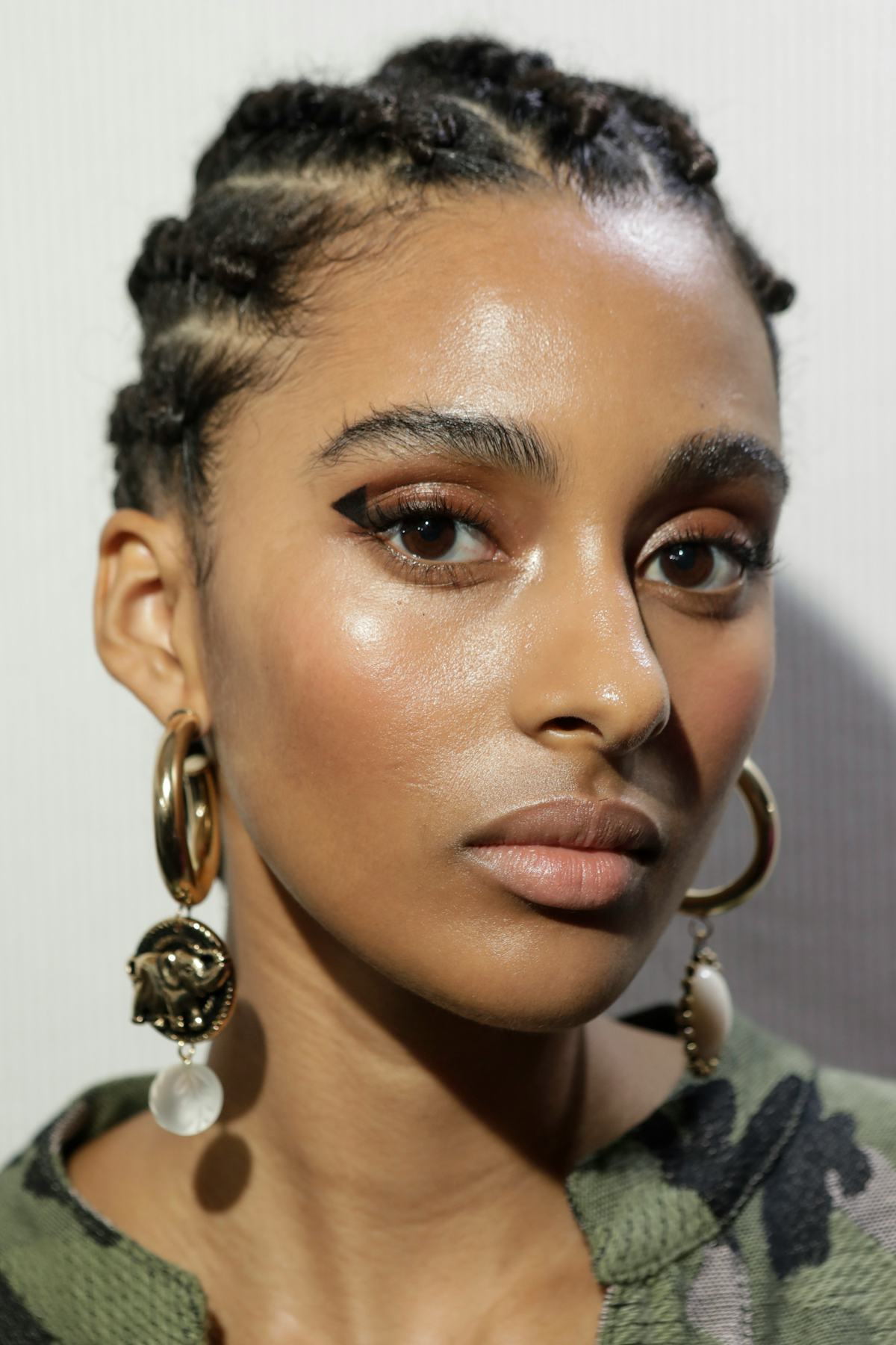 model backstage at fashion week