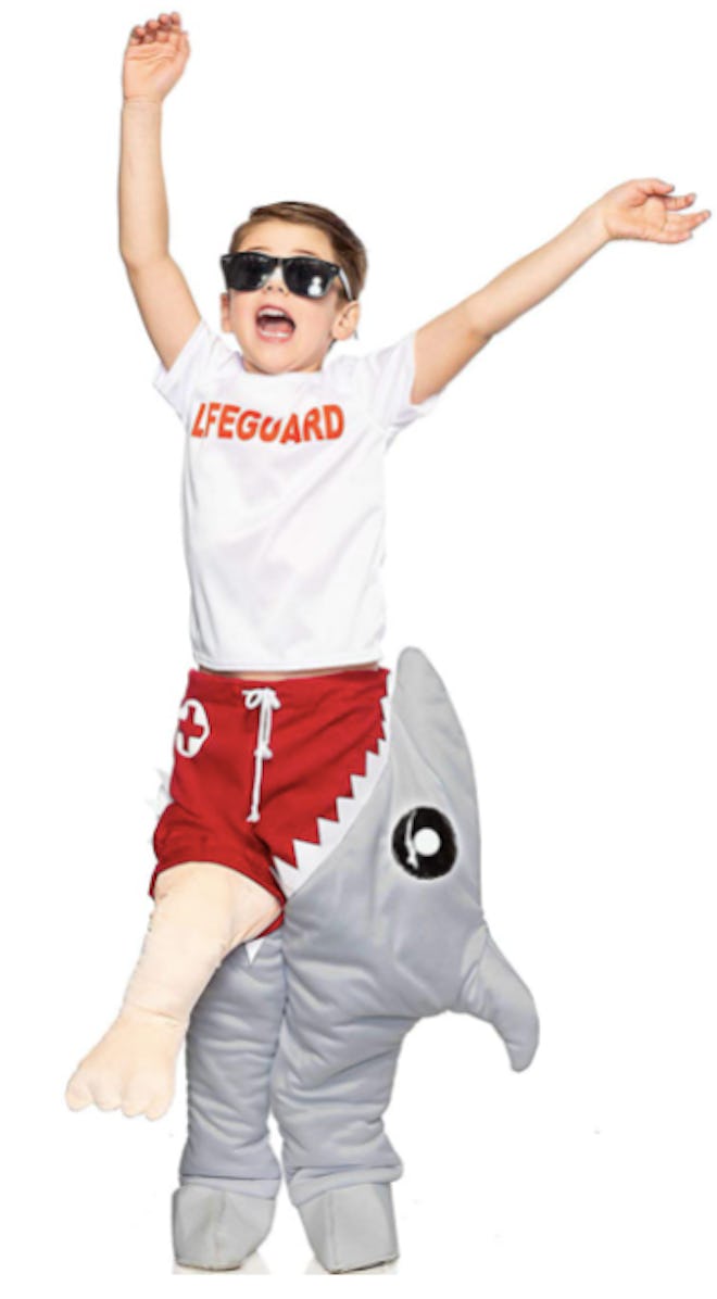 Child dressed in a shark-eating life guard costume