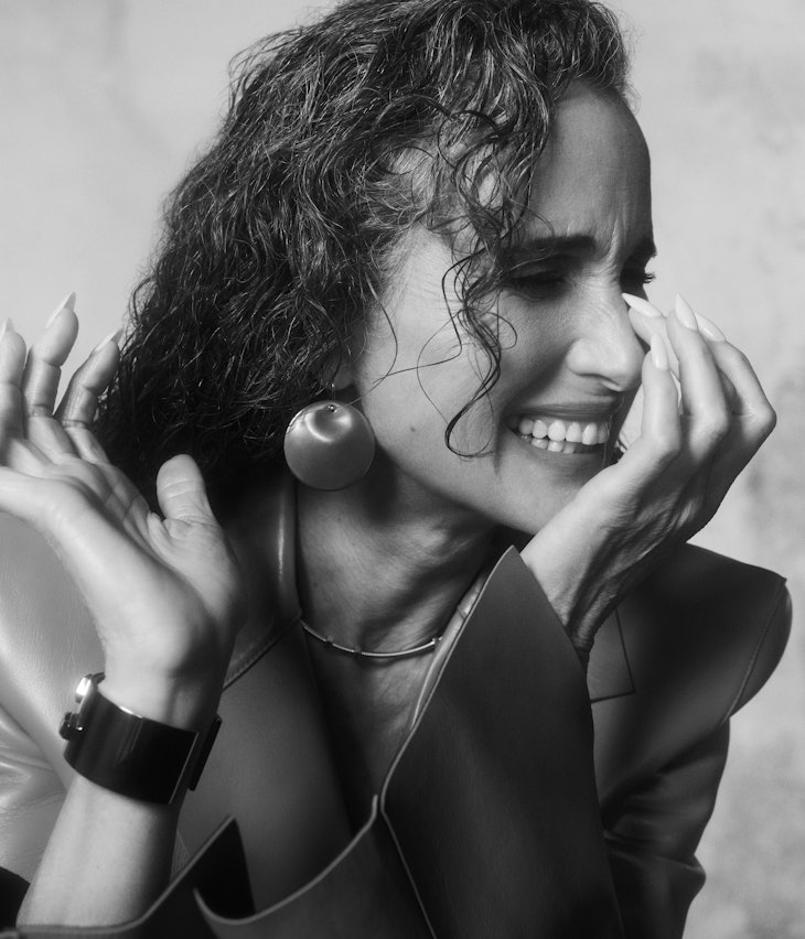A black and white close-up shot of TZR cover-star Andie MacDowell smiling.