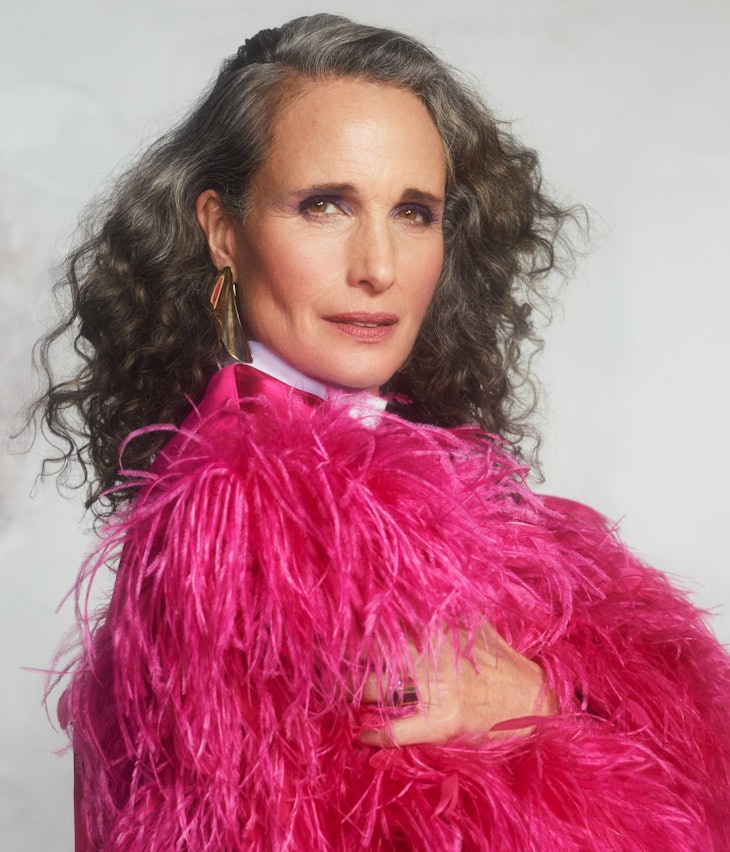 A portrait shot of TZR cover star Andie MacDowell sporting gray hair and a pink feathered Gucci top.