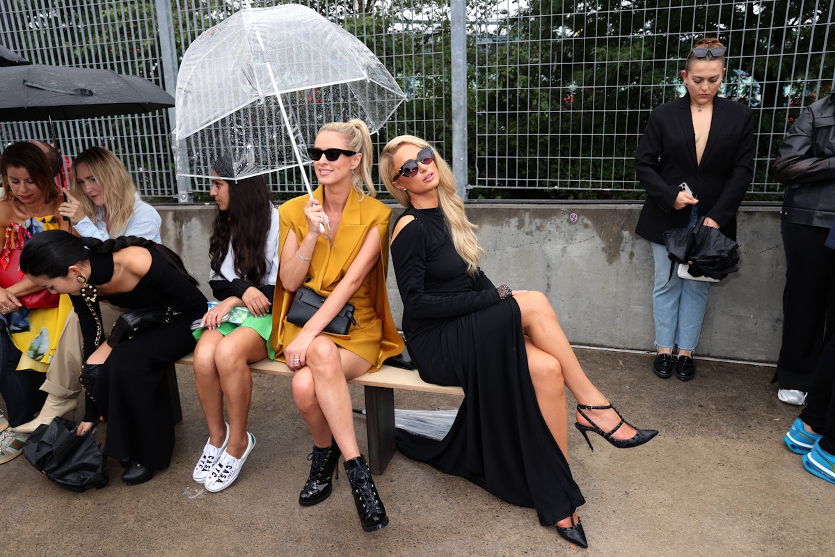 Nicky Hilton Rothschild (Center) and Paris Hilton (R) attend the front row for Monse Resort 22 durin...