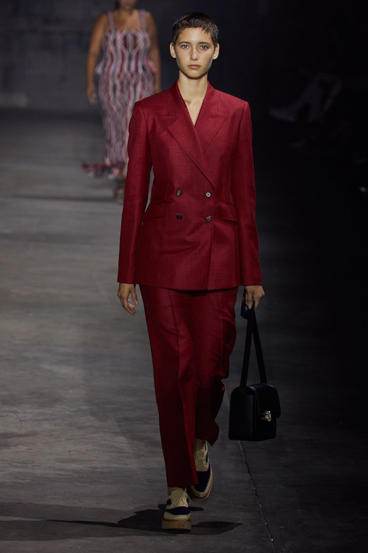A model wearing a burgundy suit by Gabriela Hearst during the NYFW Spring 2022