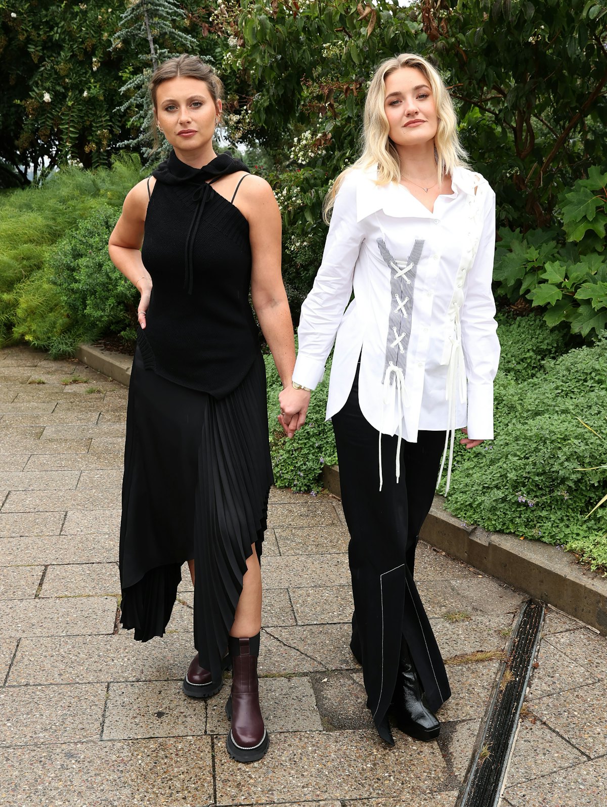  Aly Michalka (L) and AJ Michalka of Aly & AJ attend the front row for Monse Resort 22 during NYFW: ...