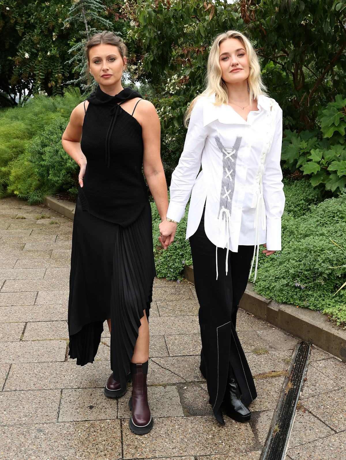 Aly Michalka (L) and AJ Michalka of Aly & AJ attend the front row for Monse Resort 22 during NYFW: ...