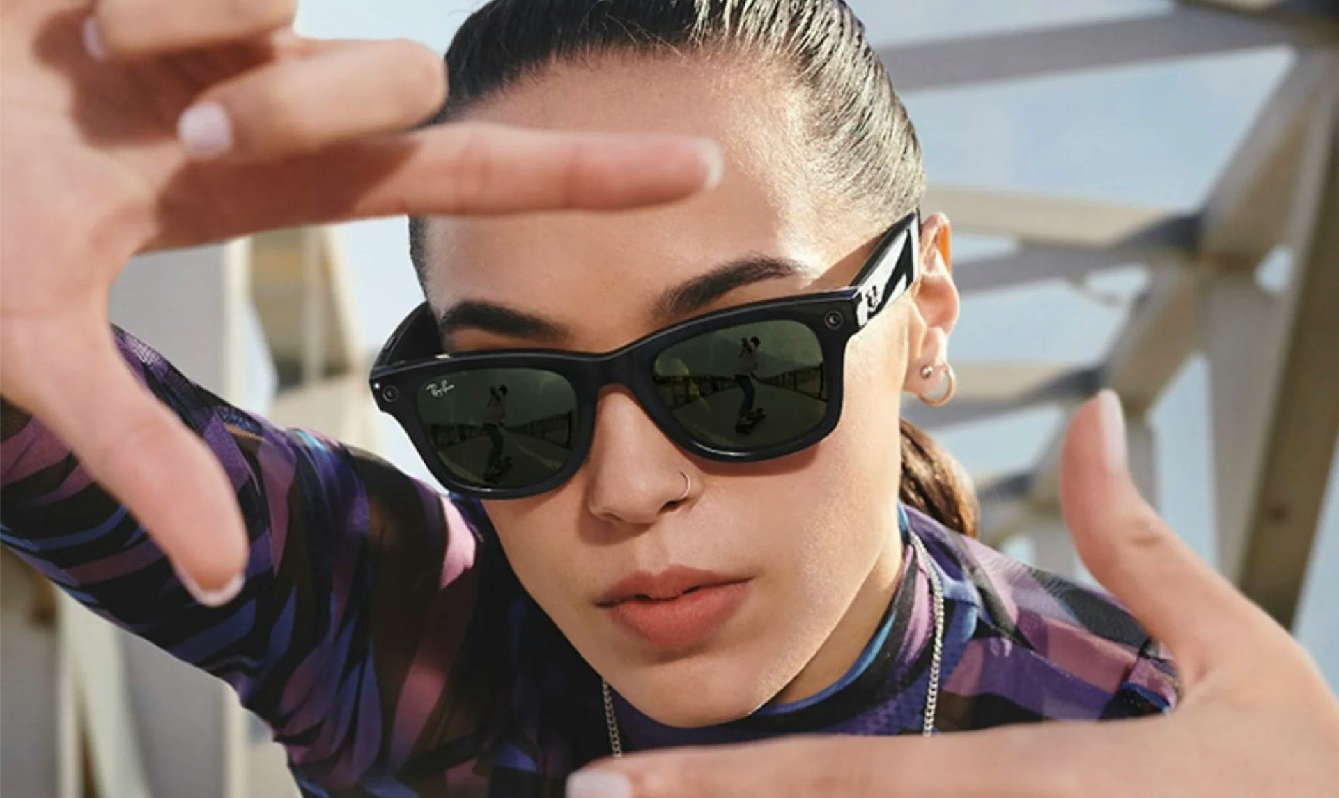 A woman wears Facebook's new smart glasses, Ray-Ban Stories.