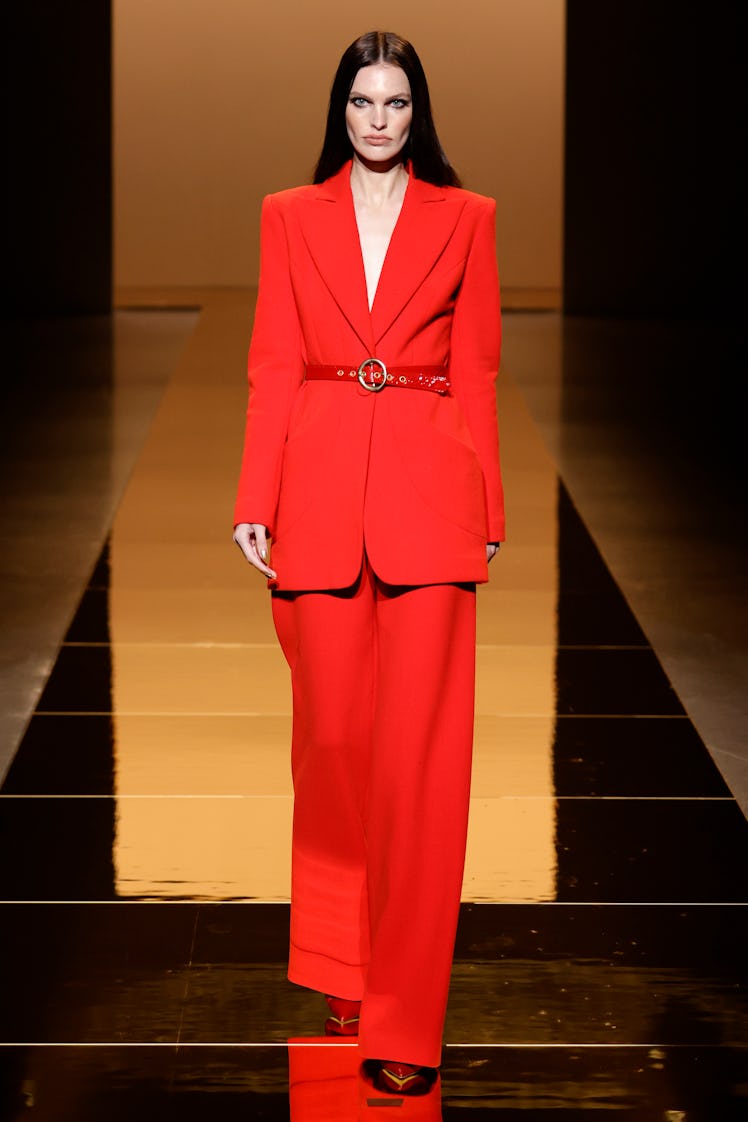 A model wearing a red suit by Sergio Hudson during the NYFW Spring 2022