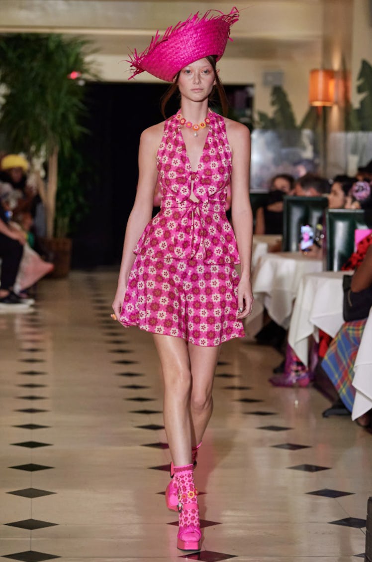 A model wearing a pink patterned dress by Anna Sui during New York Fashion Week Spring 2022