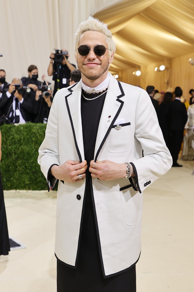Pete Davidson at the 2021 Met Gala in a Thom Browne suit dress.