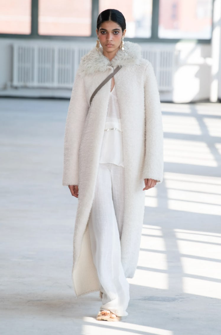 A model wearing a white Altuzarra set during New York Fashion Week Spring 2022