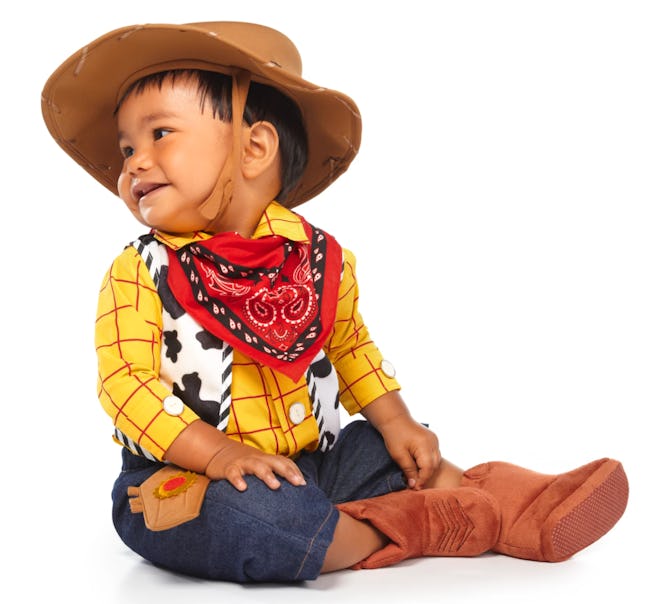Baby dressed up as Woody from "Toy Story"