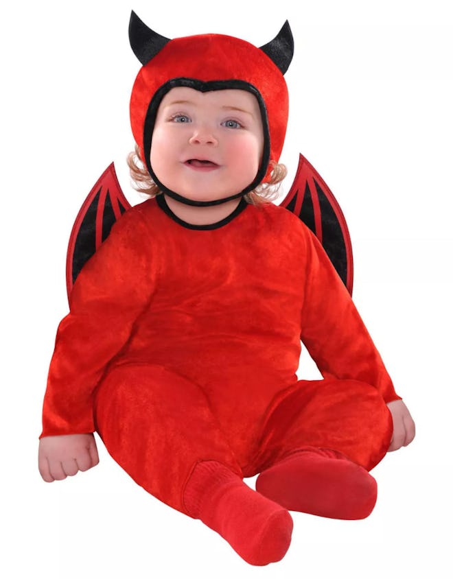 Baby dressed in devil costume