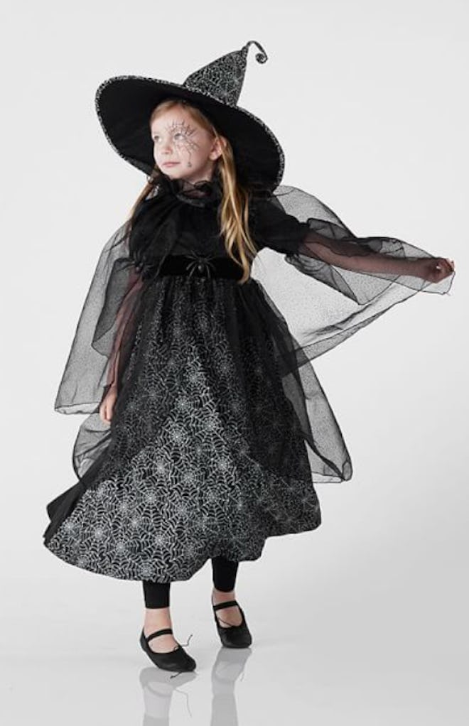 Little girl dressed up as witch for Halloween