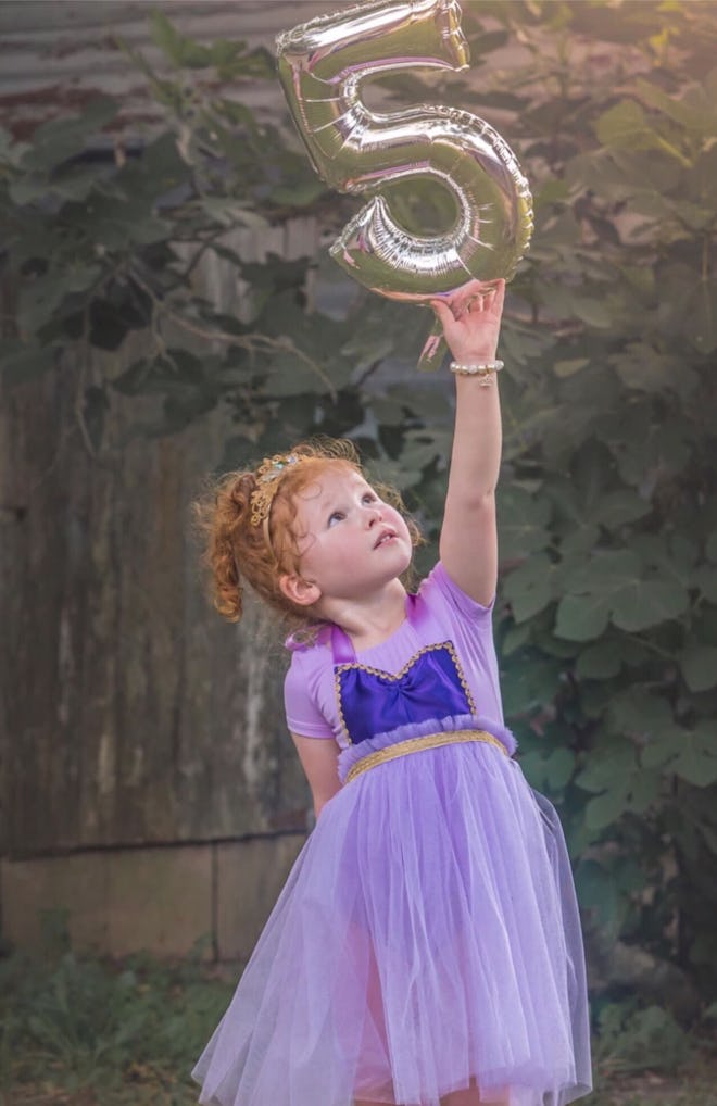 Little girl dressed in Rapunzel costume