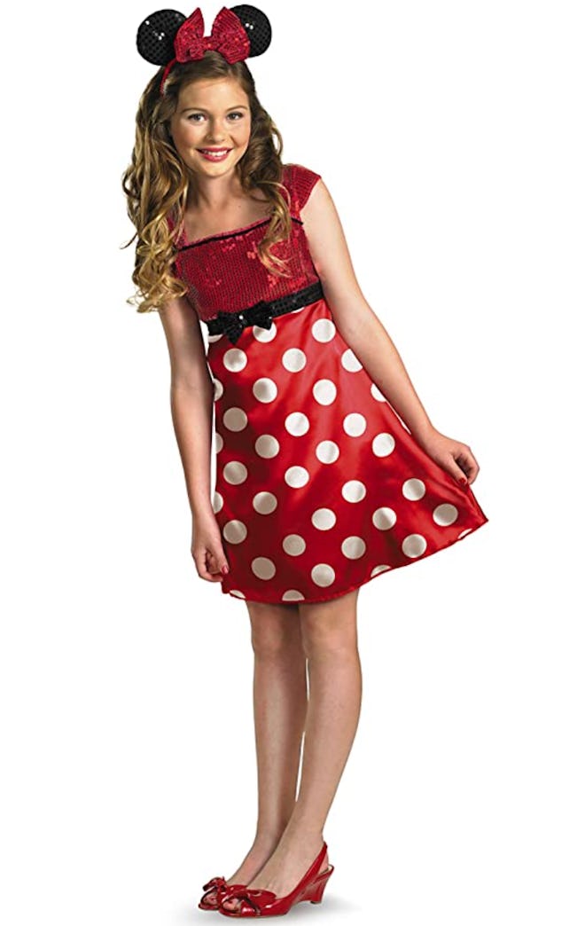 Tween girl dressed up as Minnie Mouse