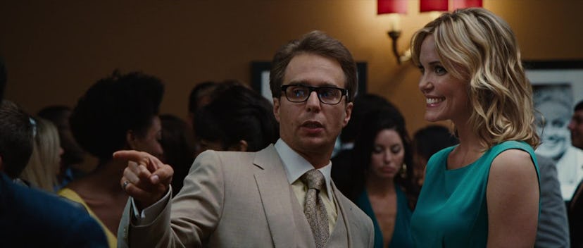 A still from 'Iron Man 2,' with Sam Rockwell (Justin Hammer) pointing during a professional event.