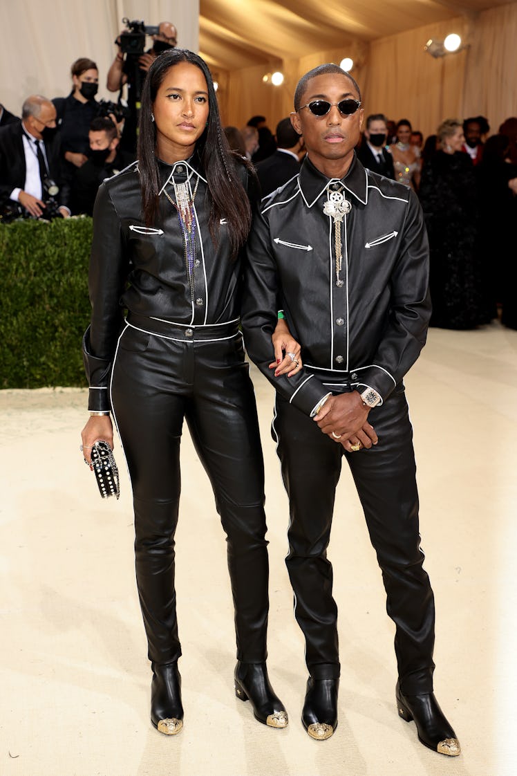 Helen Lasichanh and Pharrell Williams attend The 2021 Met Gala Celebrating In America: A Lexicon Of ...