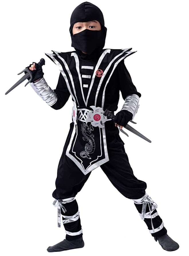 Little boy posing in ninja costume