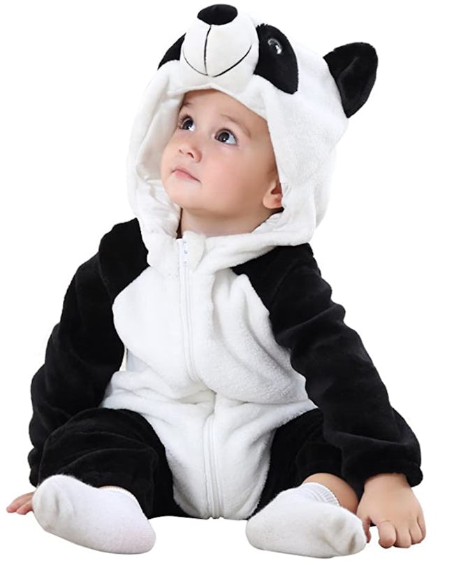 Baby sitting, posing in panda bear costume onesie