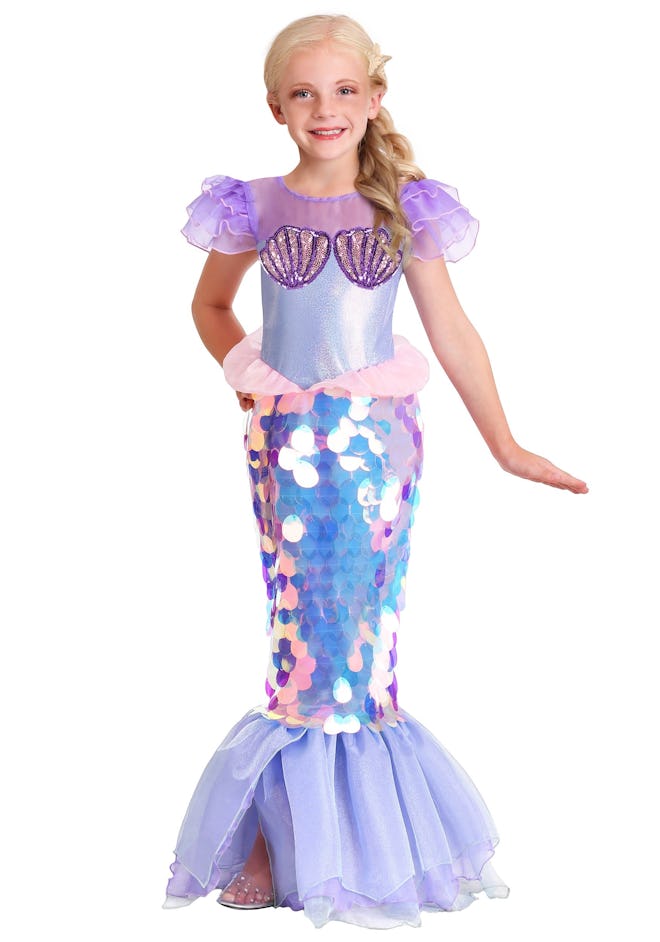 Child posing in mermaid Halloween Costume