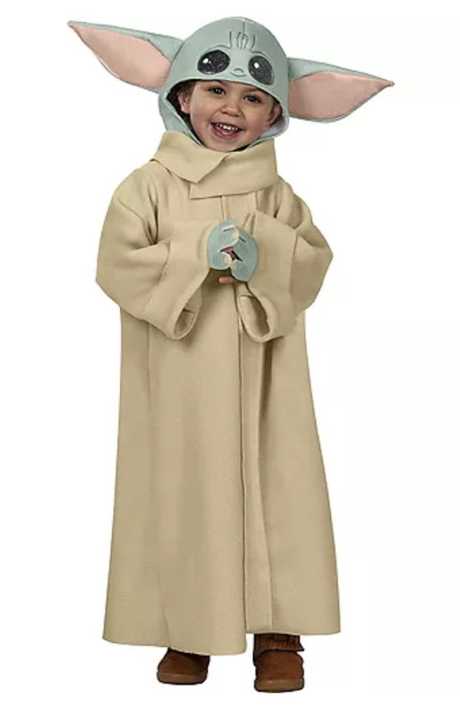 Toddler dressed up in Baby Yoda costume