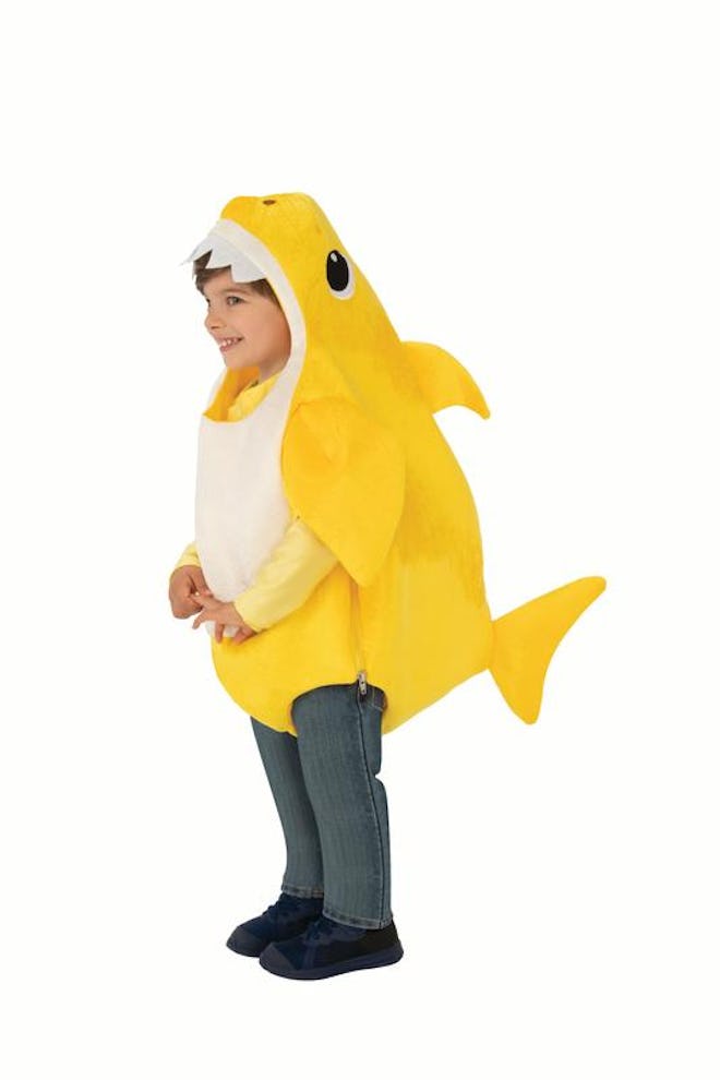 Toddler dressed in yellow Baby Shark costume