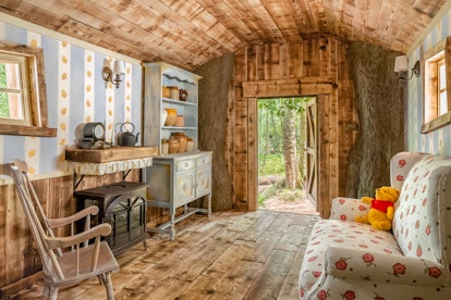 Disney's 'Winnie the Pooh' treehouse Airbnb has Winnie the Pooh details inside like hunny pots and w...