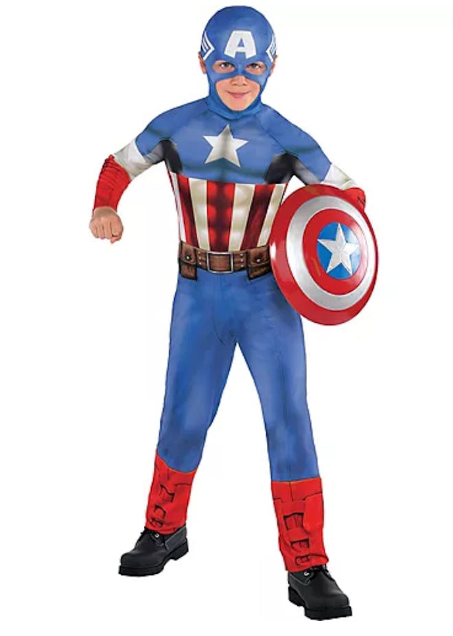 Boy standing, posing in Captain America costume