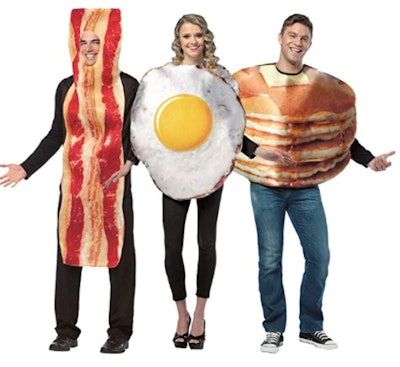 adults wearing bacon, eggs, and pancakes costumes