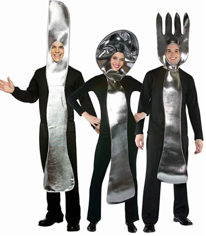 Three adults dressed as a fork, knife, and spoon