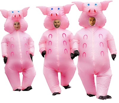 Adults dressed as three little pigs